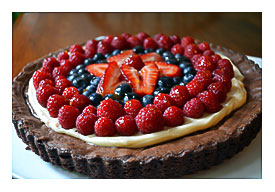 Brownie Tart Topped With Sweetened Cream Cheese And Berries